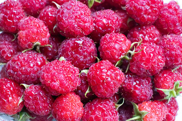 Raspberry. Juicy raspberries close-up. The taste of summer. Summer mood.