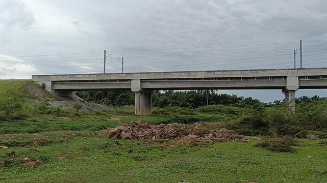 ETS (electric train service)  train  railroad bridge with no train passing by in kluang, johor,  malaysia