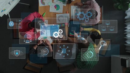 A dynamic overhead view of a business team engaged in collaboration and strategy planning. Digital technology overlays showcase data analysis tools and connectivity. Raster - Powered by Adobe