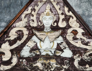 Intricate patterns on the weathered wood highlight artistic craftsmanship