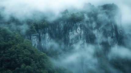 Misty Mountain Cliffs with Lush Green Foliage