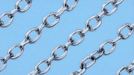 Obraz premium Close-up of shiny metal chains on a soft blue background, creating a striking visual contrast.