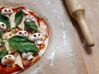 Making homemade pizza for Halloween. High quality photo