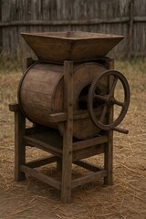 Fototapeta premium A rustic, vintage wooden thresher, a traditional agricultural machine with a large wheel and a wooden hopper, standing in a field of dry grass, a classic piece of farming history.