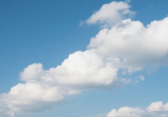Naklejka premium Clear Blue Sky with White Clouds on a Bright Sunny Day