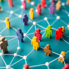 Colorful wooden figures connected by white lines on teal background connection network