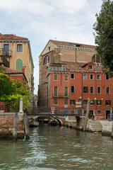 Venice, Italy - August 22, 2019: Architecture and facade of the old city buildings of Venice