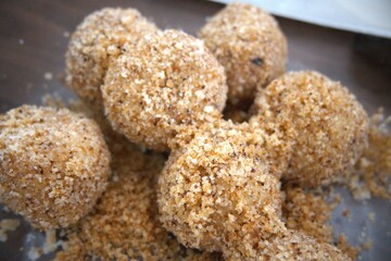 Traditional Hungarian plum dumplings (szilvás gombóc) served in a clear glass bowl. Authentic homemade dessert.
