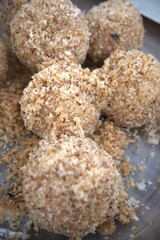 Traditional Hungarian plum dumplings (szilvás gombóc) served in a clear glass bowl. Authentic homemade dessert.