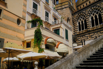 Amalfi, Italy – colorful yellow buildings and charming streets in the historic center along the Amalfi Coast.