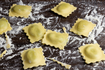 Beautiful raw ravioli stuffed with ground beef shallow DOF