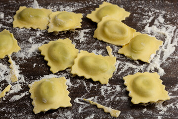 Beautiful raw ravioli stuffed with ground beef shallow DOF