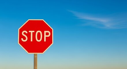 Stop Sign in Blue Sky.