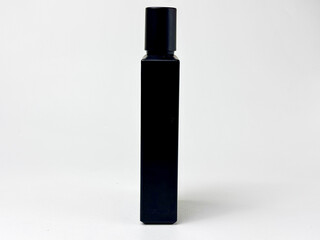 Modern black square perfume bottle on white background offering a blend of elegance and mystery for cosmetic advertising and product display with high contrast visuals against seamless backdrop