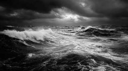 A monochrome ocean churns under a stormy sky with dramatic lighting effects