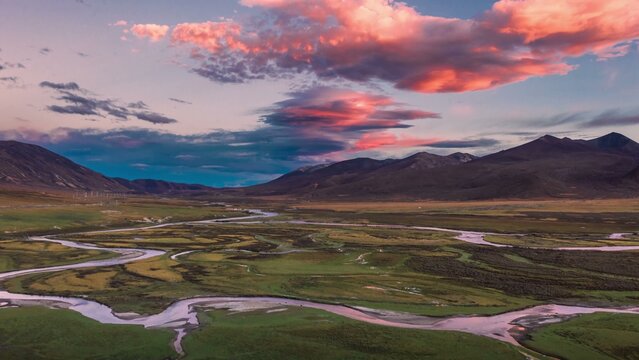 Vast valley with winding river at sunset - Powered by Adobe