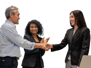 Construction engineers discuss the design with the project owner and the construction site and shake hands to agree on the work.