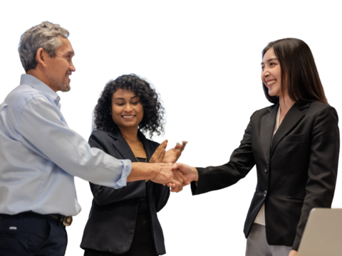Construction engineers discuss the design with the project owner and the construction site and shake hands to agree on the work.