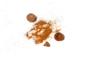 organic brown palm sugar or jaggery isolated on white background.