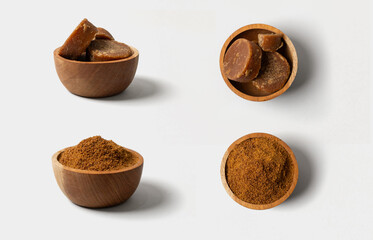 organic brown palm sugar or jaggery on bowl isolated on white background.
