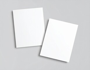Fototapeta premium Blank folded paper mockup on gray background, top view of empty white sheet template for flyer, brochure, invitation, or leaflet design presentation, minimal clean stationery concept with soft shadows