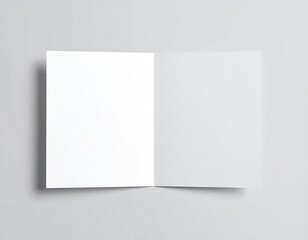 Fototapeta premium Blank folded paper mockup on gray background. Top view of empty white sheet template for flyer, brochure, invitation, or leaflet design. Minimal stationery concept with clean surface and soft shadows.