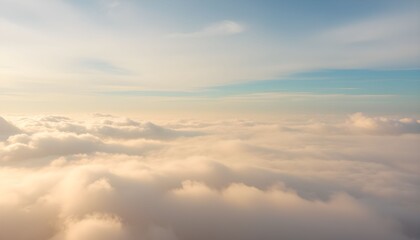 Fototapeta premium High-altitude view of clouds illuminated by golden sunlight.