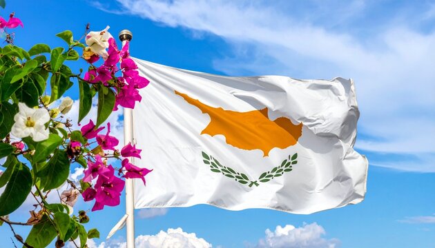 Cyprus national flag waving in the wind with colorful flowers and blue sky background.