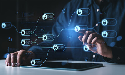 Digital cybersecurity network interface with padlock symbols being navigated on a touchscreen device by a user in a dark environment.