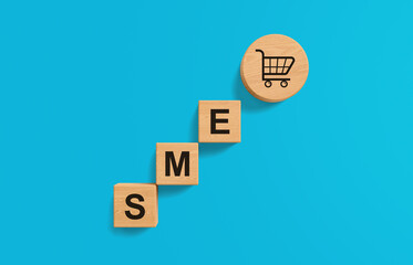 Wooden blocks spelling SME with shopping cart icon on blue background symbolizing small business growth and commerce concept in 3D rendering style. 3D Rendering
