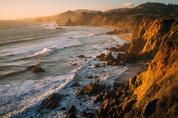 Obraz premium wide sweeping coastal cliffs glowing at sunrise, golden light hitting the ocean waves, airy bright atmosphere.
