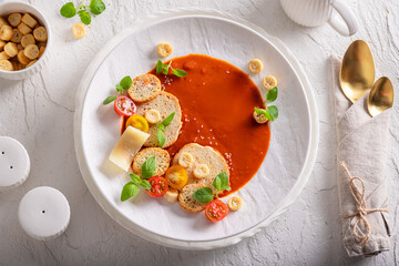 Elegant tomato soup as elegant and tasteful fine dish.