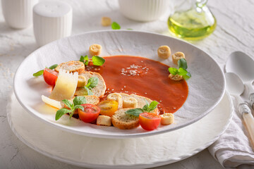 Professional tomato soup as culinary artistry in top chef kitchen.