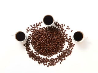 Freshly brewed black coffee in three white cups surrounded by roasted coffee beans on a clean white background, top view flat lay.