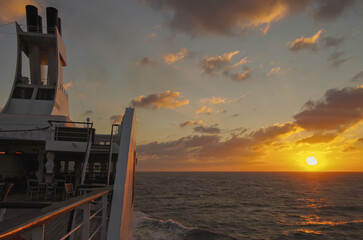 Scenic panoramic seascape view of Ocean and clouds and blue hour twilight sky in Piraeus Athens, Greece seen from outdoor deck of luxury cruiseship cruise ship liner