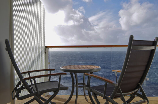 Fototapeta Scenic panoramic seascape view of Ocean and clouds and blue hour twilight sky in Piraeus Athens, Greece seen from outdoor deck of luxury cruiseship cruise ship liner