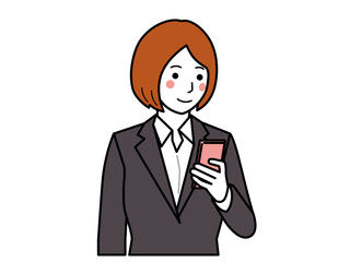 チャコールスーツ。スマホを見る女性