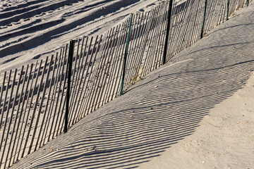 fence at the beach gives a harmonic shadow © travelview