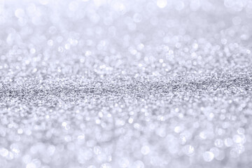 Abstract silver glitter sparkle texture with bokeh background