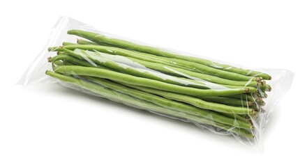 Green beans encased in a transparent plastic bag laid horizontally on a white backdrop