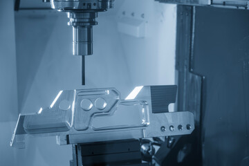 The 5-axis CNC milling machine cutting the aerospace part with solid flat nose end mill tool in the light blue scene.