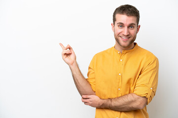 Young caucasian man isolated on white background pointing finger to the side