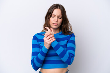 Young caucasian woman isolated on white background suffering from pain in hands