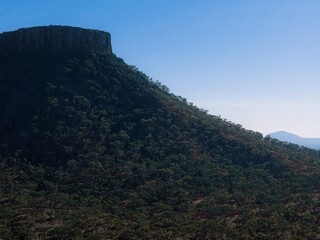 Drone aerial view of rugged mountain ranges in Outback Queensland, Australia – remote wilderness landscape showcasing rocky terrain, vast horizons, and natural beauty