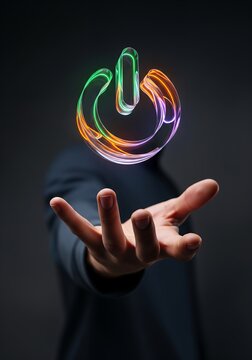 Man holding hand under neon glass power button