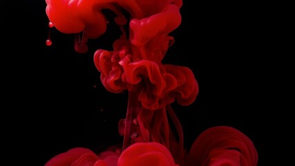 Crimson ink plume explodes and swirls on black background - Powered by Adobe