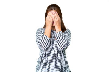 Middle age woman over isolated background covering eyes by hands