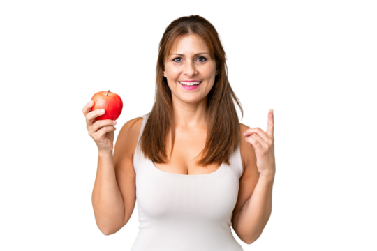 Middle age woman with an apple over isolated background pointing up a great idea