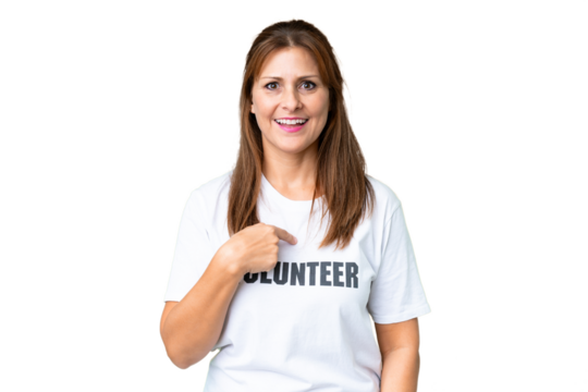 Middle age volunteer woman over isolated background with surprise facial expression