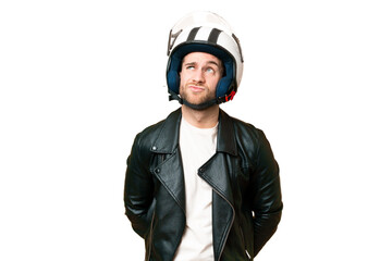 Young handsome blonde man with a motorcycle helmet over isolated chroma key background and looking up
